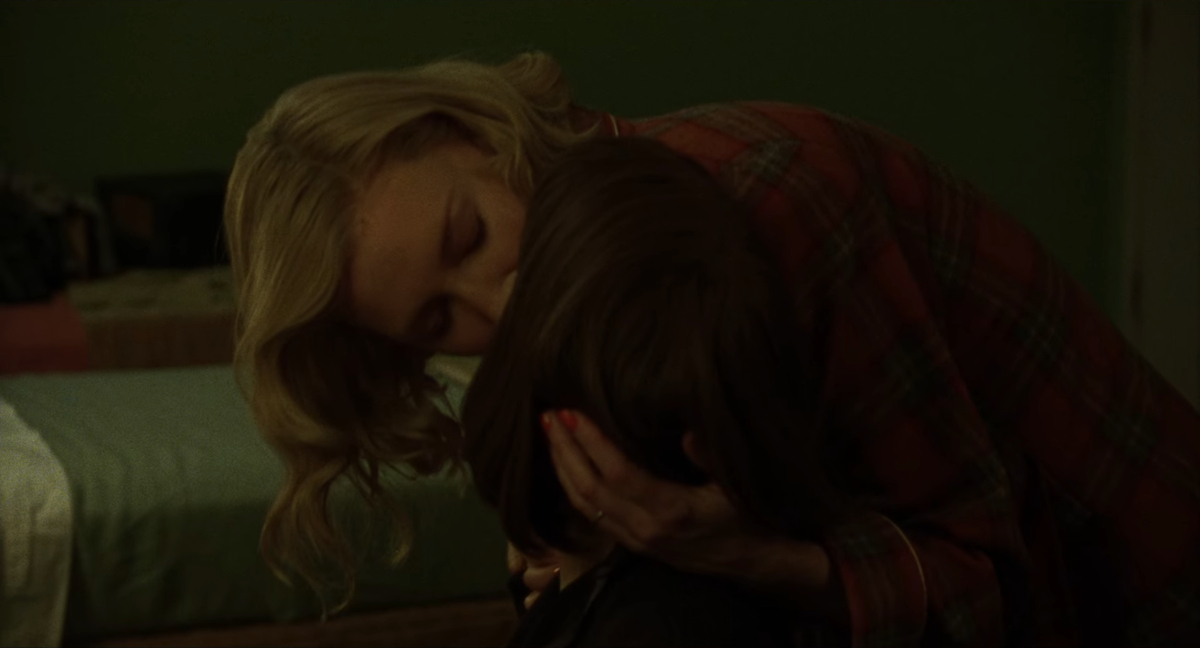 Carol bends down to kiss Therese