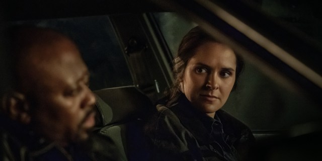 Detective Burke stares at Detective Howard in the season three premiere of Raising Kanan. They are both in a car at night.