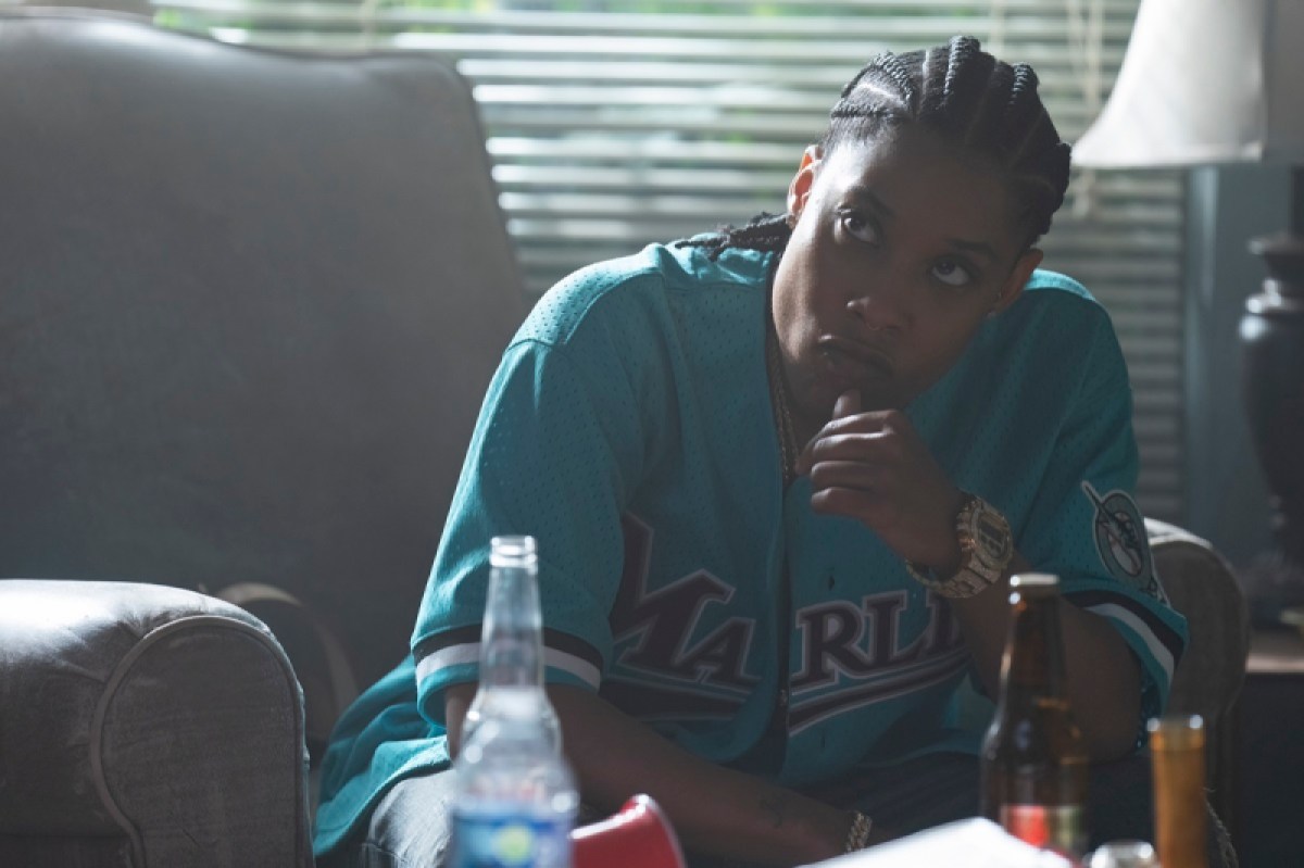 Wearing a slightly opened Florida Marlins baseball jersey, Chastity listens to her girls relay what's been going on since she's been away.