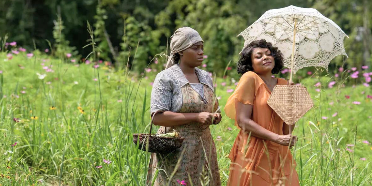 Shug and Celie walk through a field in 2023's The Color Purple