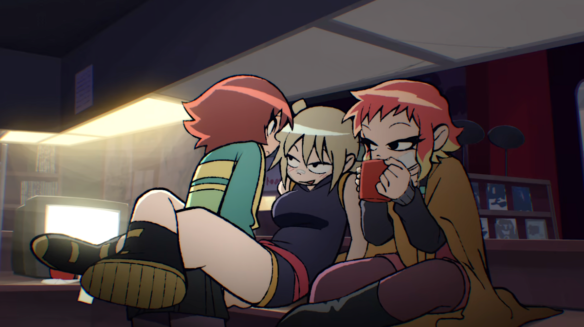 A cartoon of one girl sitting on another girl's lap facing her as a third girl sits next to them sipping from a mug.