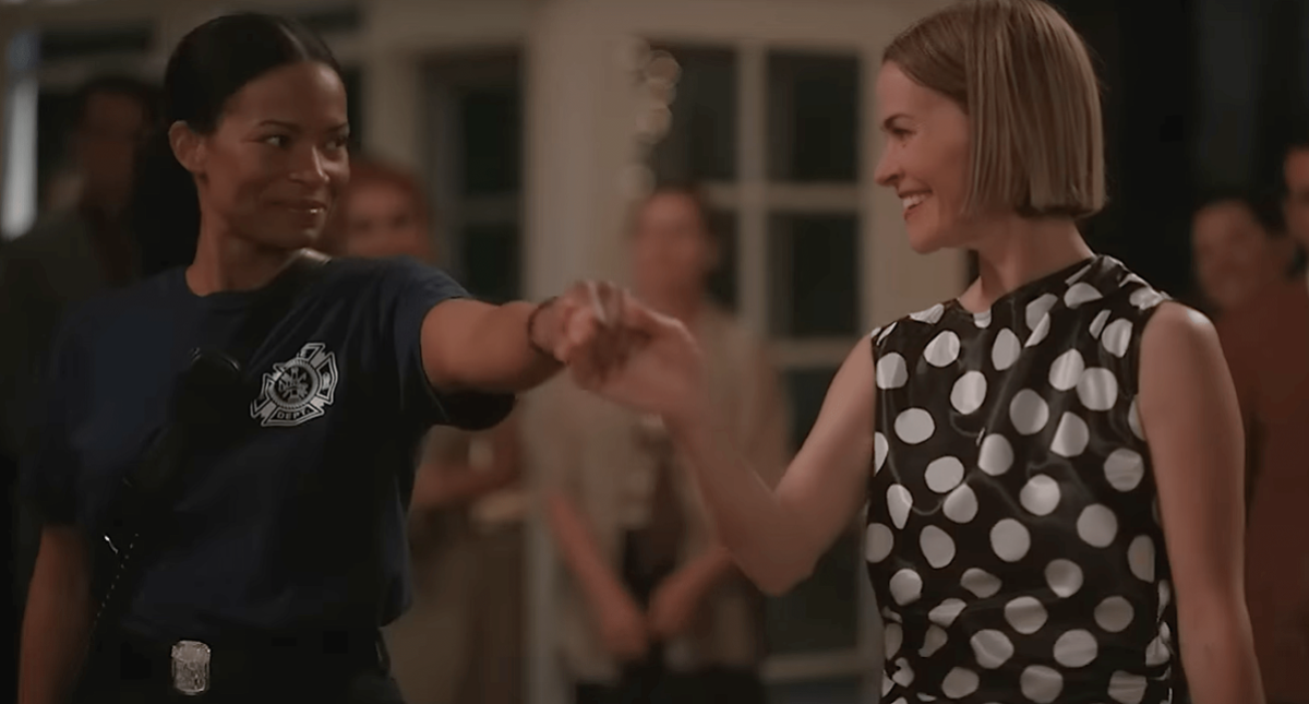 Best queer TV scenes of 2023: Alice in a black and white polka dot dress dances with Tasha dressed as a fire fighter