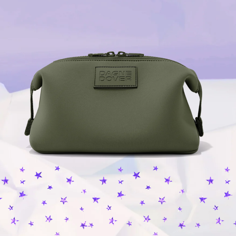 a travel bag in green with purple stars underneath it