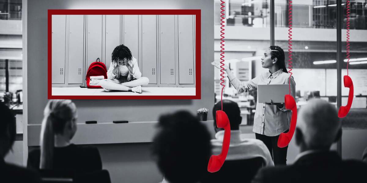 a black and white photo of a woman presenting to a group. up on the board is a photo of a young black girl in a school hallway crying. her backpack is red. three red phones hang down in front of the image