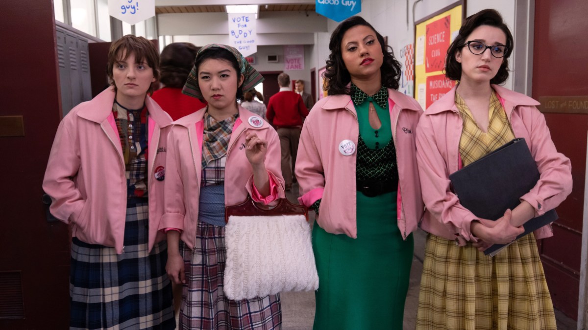the pink ladies stand in the hallway