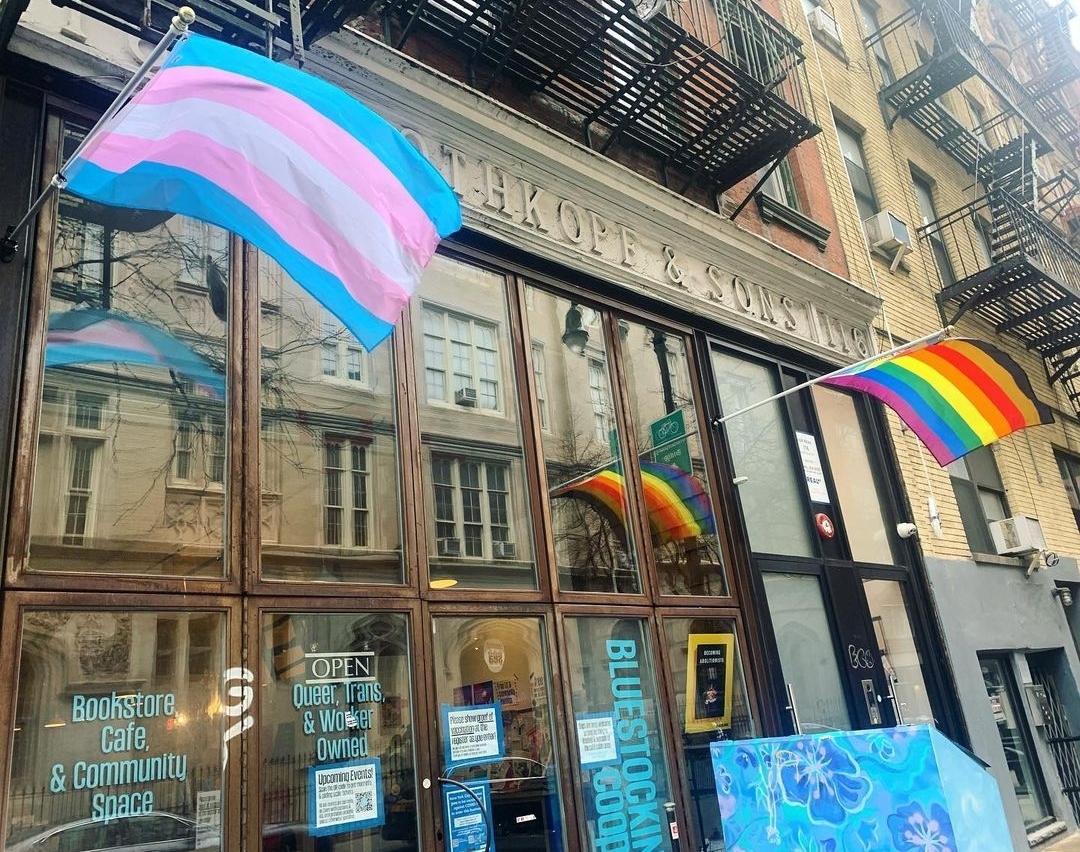 Bluestockings bookstore flying a trans flag and a pride flag