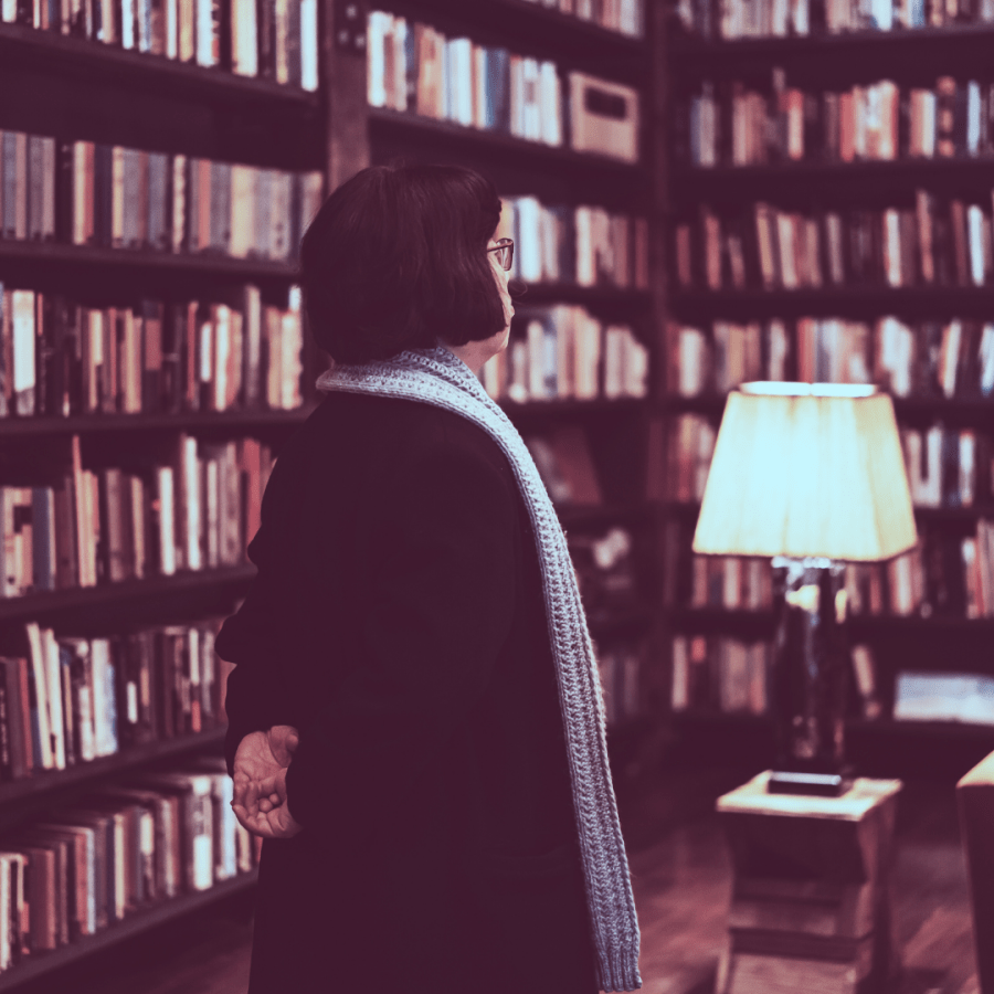 A person with a bob haircut in a library