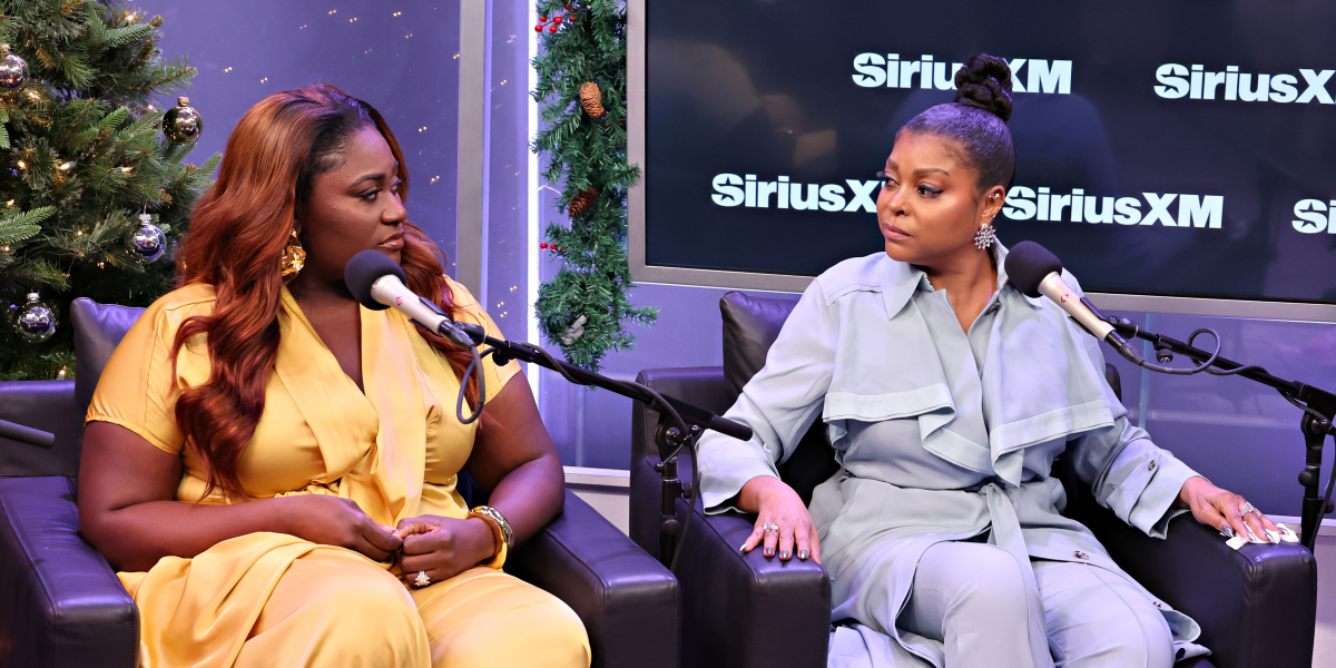 Danielle Brooks and Taraji P. Henson look at each other while being interviewed by SiriusXM.