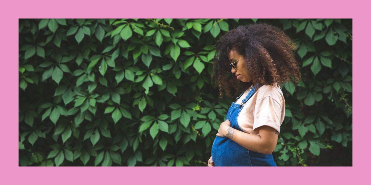 a pregnant woman in overalls