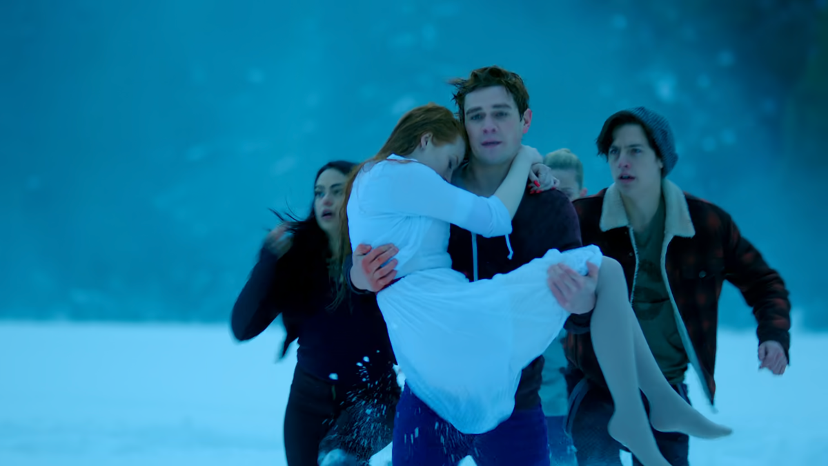 Archie carries Cheryl through the snow with Betty, Jughead, and Veronica running beside him