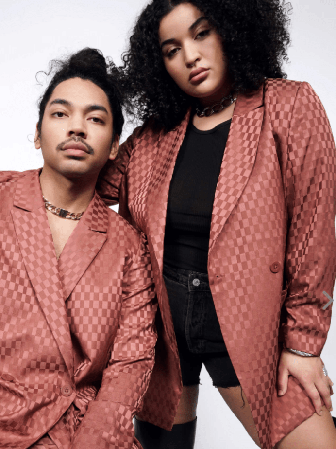 plus size wedding guest inspiration: a dark orange patterned checkered suit from Wildfang