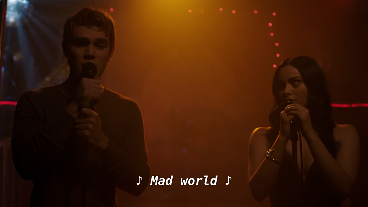 Archie and Veronica sing Mad World in orange lighting