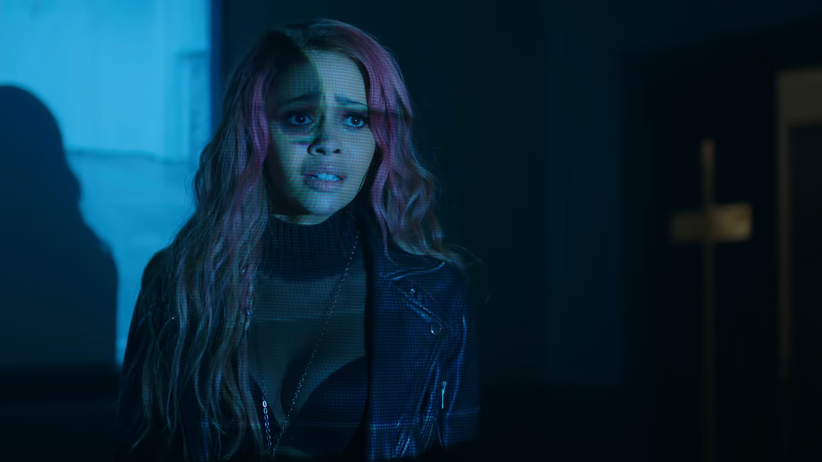 Toni in a see through top with a visible bra