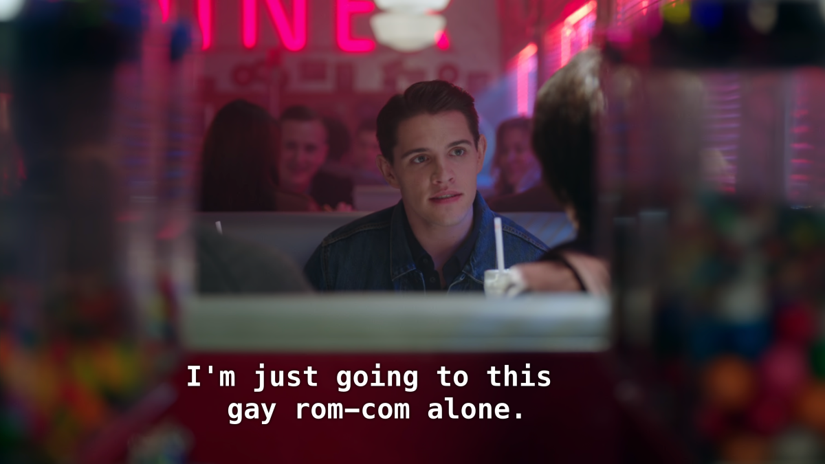 Kevin sits in a diner booth. "I'm just going to this gay rom-com alone."