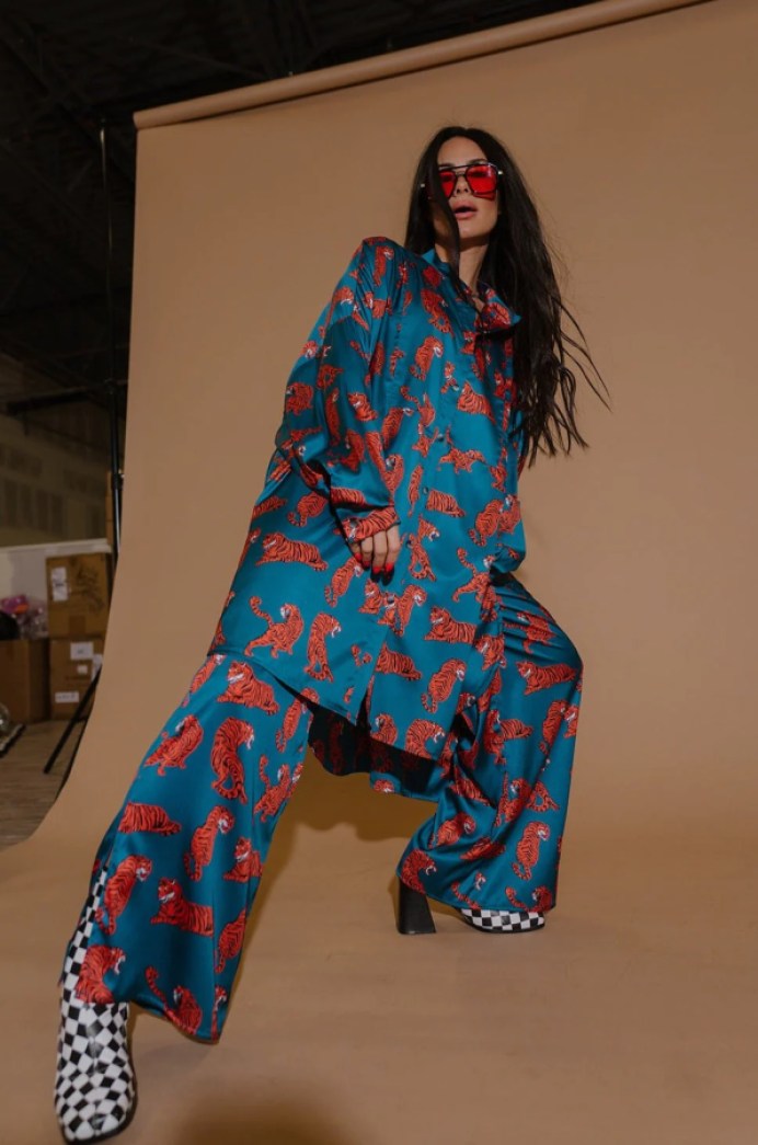 plus size wedding guest inspiration: a printed oversized blue and red suit