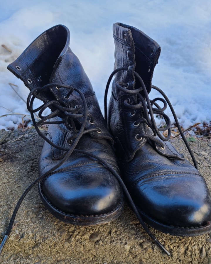 a black pair of Frye's lace-up boots
