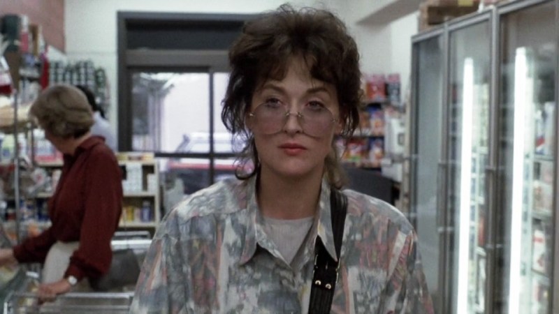 Meryl Streep in sunglasses looking depressed in an 1980s supermarket in Heartburn