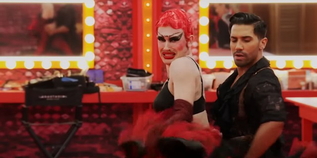 Drag race 1606: Plane Jane with poorly drawn unibrow and mustache flamenco dances with a partner
