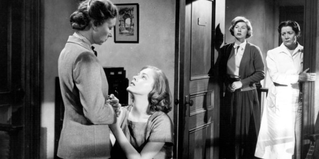 Eleanor Parker pleads on her knees with Agnes Moorehead in Caged (1950)
