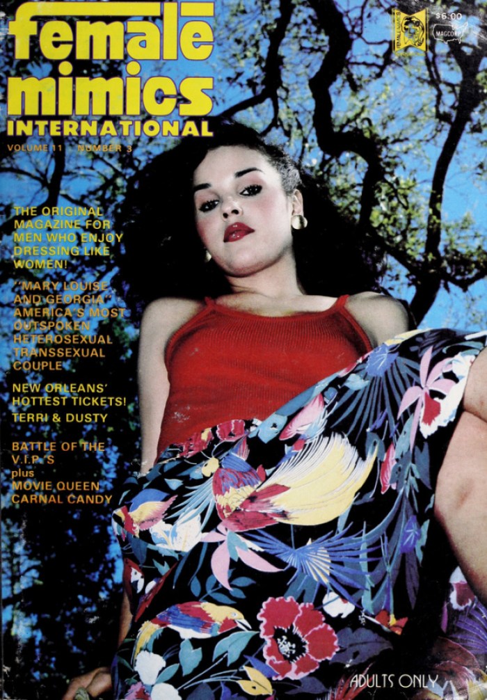 F.M.I. Magazine Cover, Mary Louise and Georgia America's Most Outspoken Heterosexual Transsexual Couple, a trans Latina with a beauty mark looks down sitting among trees wearing a red tank top and floral skirt.