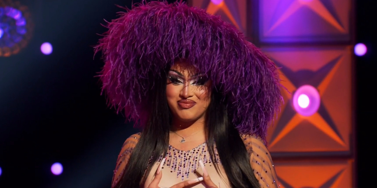 Drag Race 1610: A close up on Morphine with her ostrich feather purple hat