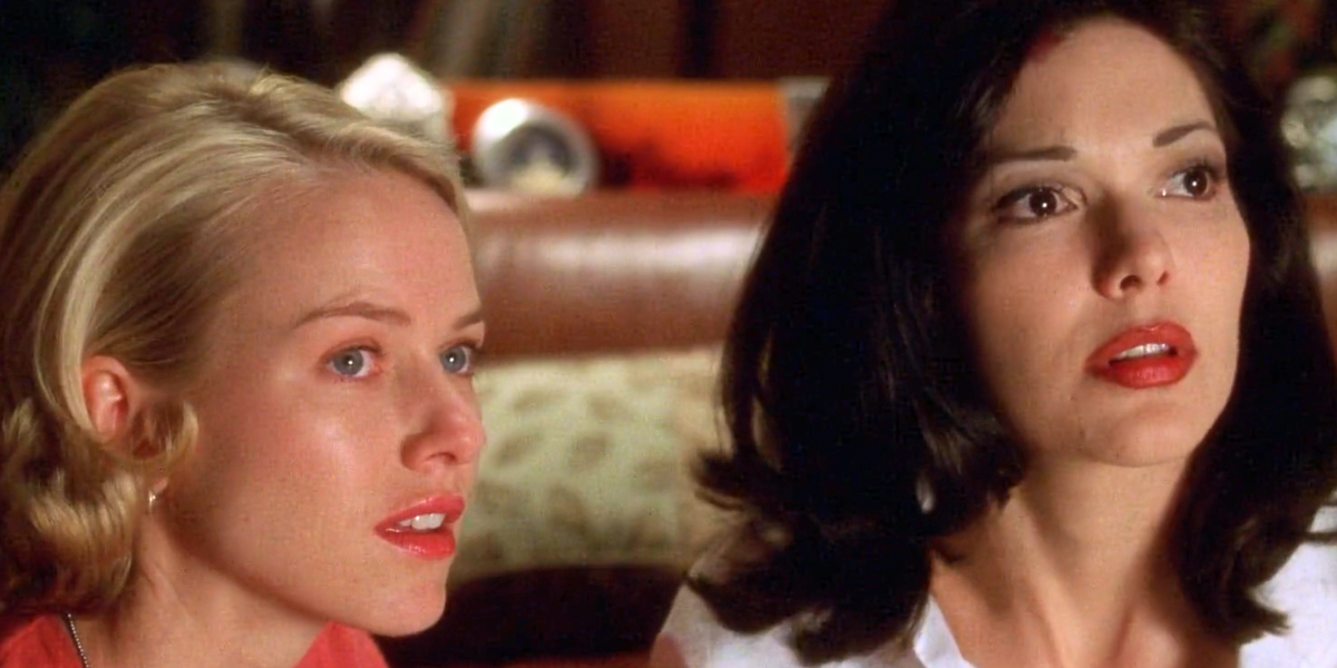 Betty and Rita look toward the door scared in Mulholland Drive