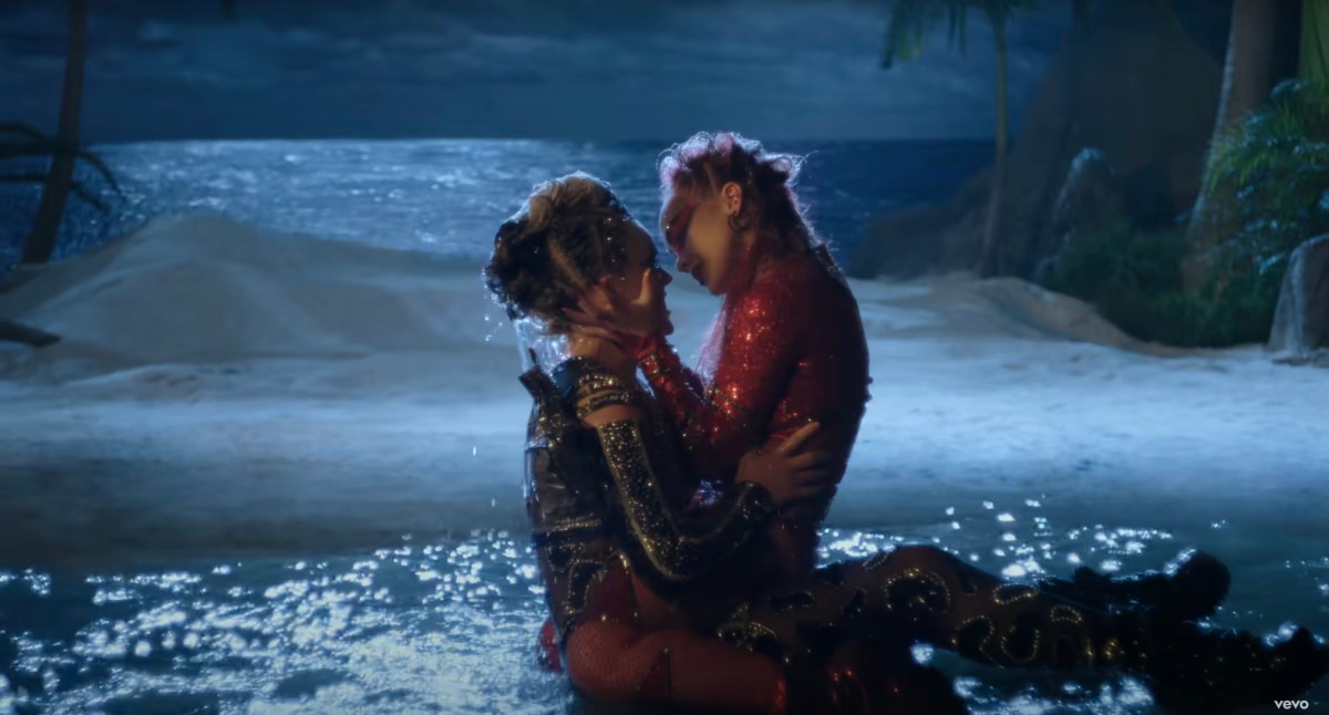 jojo and girl making out on an island