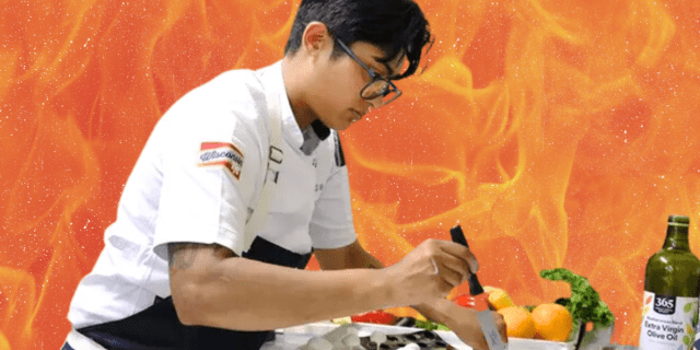 Rasika, the lesbian contestant on 2024's Top Chef, is cooking in the kitchen collaged in front of a sexy fire background