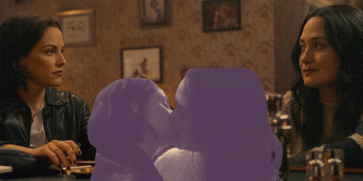 cam and rebecca kiss in front of an imgae of them both at the bar