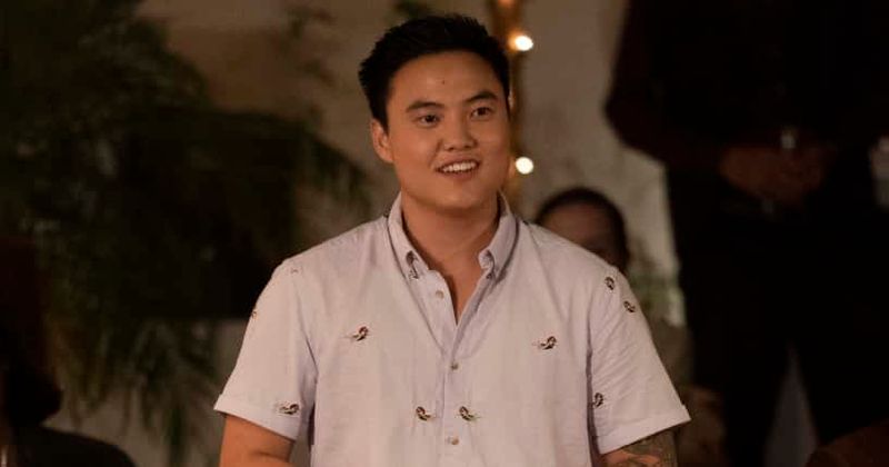 micah lee smiling in a white button-up shirt