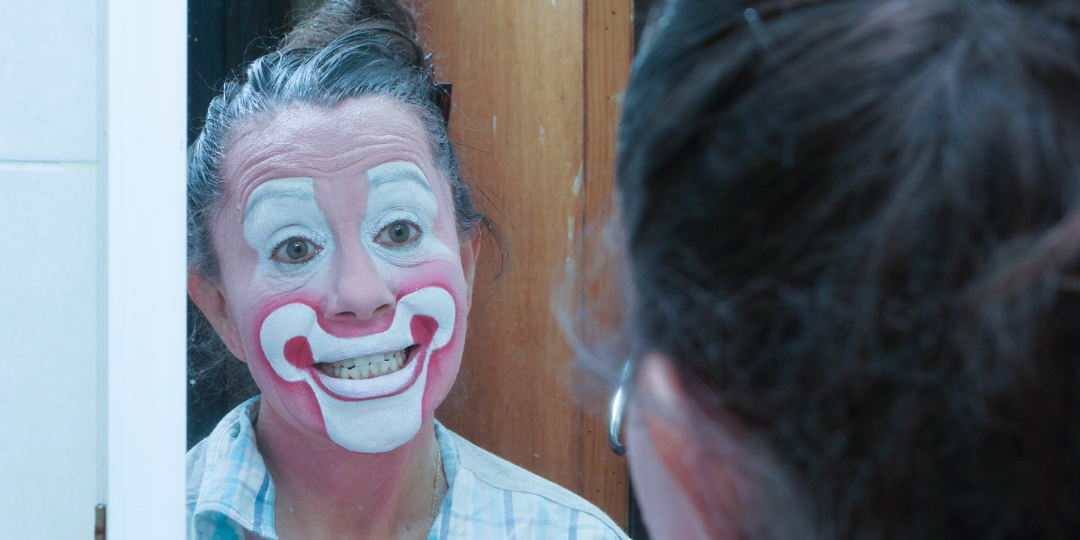 a woman with clown makeup on