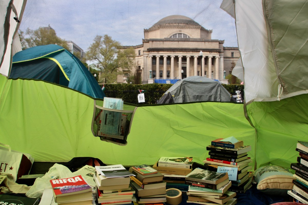 A library set up inside a tent in the “Gaza Solidarity Encampment” at Columbia University. Photo by Mukta Joshi