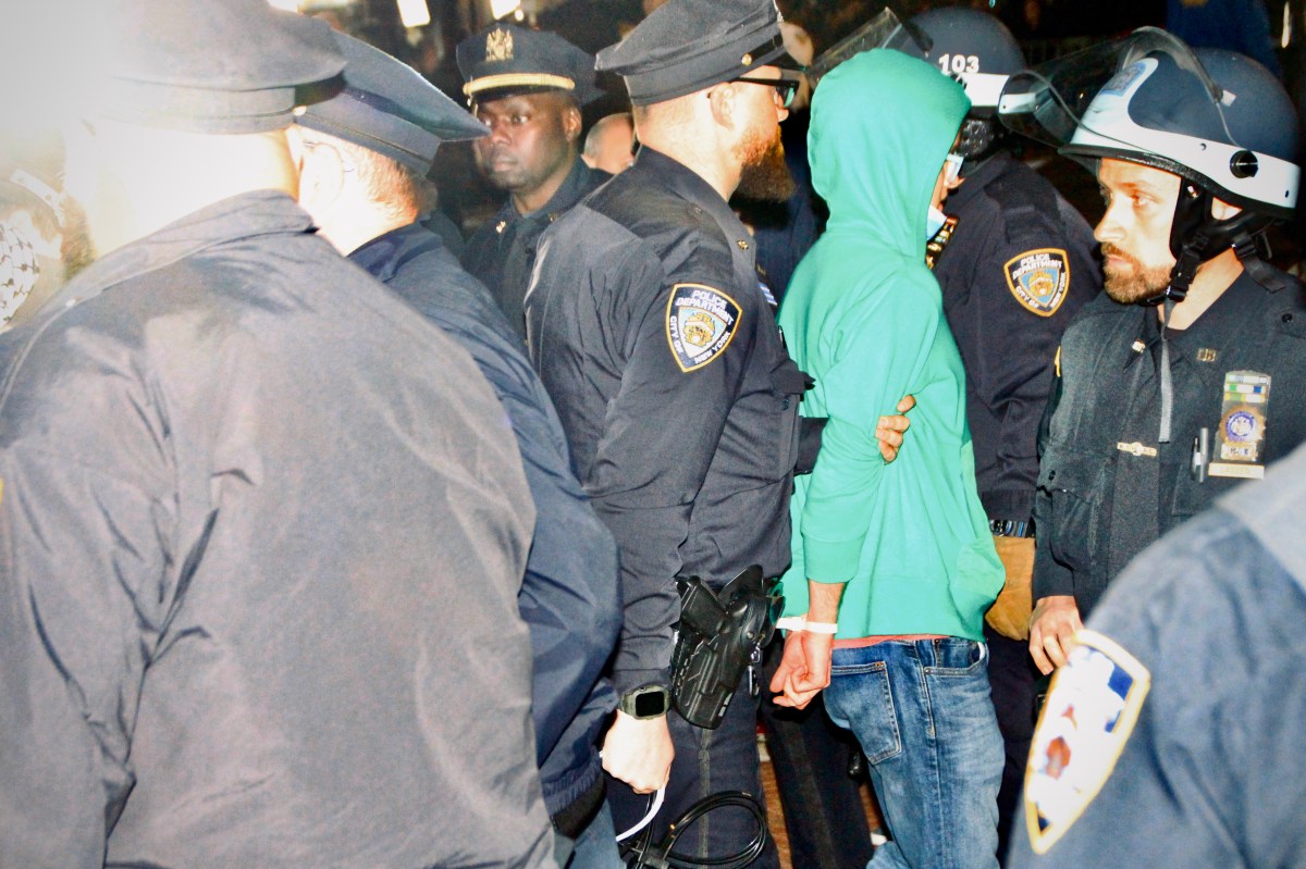 A protestor is arrested on the night of April 30, outside Columbia’s gates on Amsterdam Avenue. Photo by Mukta Joshi. 