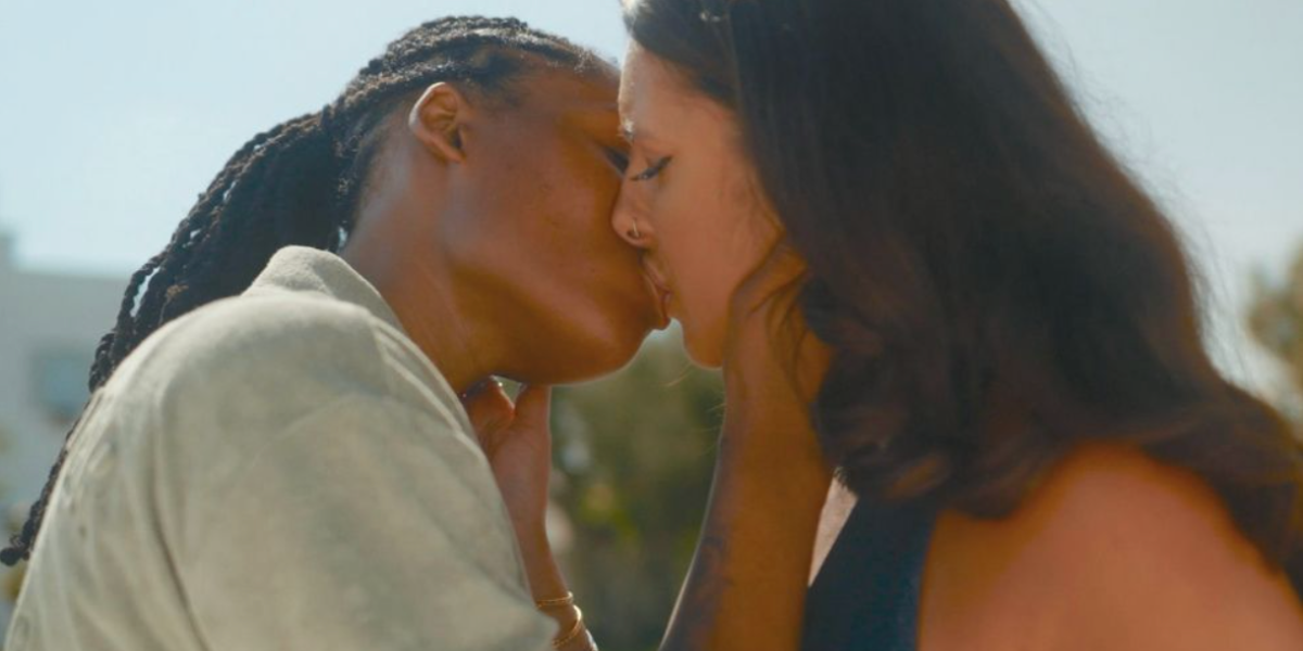 I Kissed a Girl: Priya, a South Asian South Welsh femme, and Naee, a masc Londoner from a Jamaican family, kiss