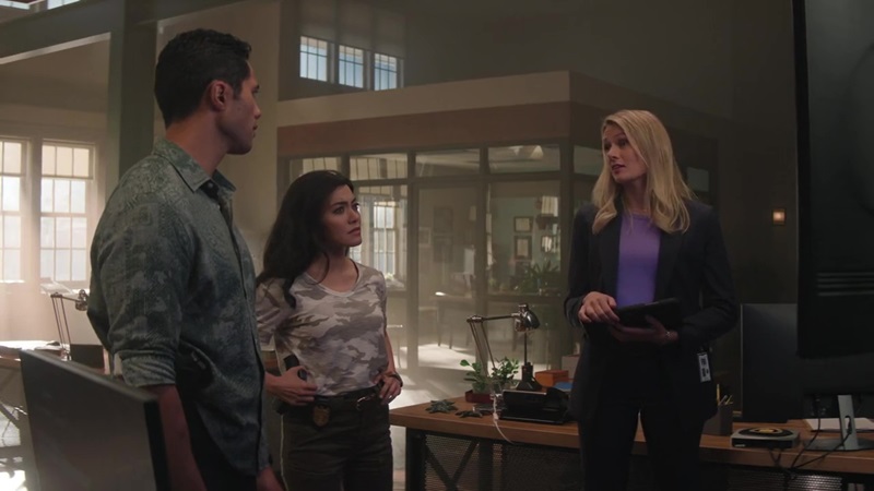 Kai, Lucy and Kate (L to R) stand in NCIS bullpen and go over the details that Kate's uncovered about their terrorism suspect.