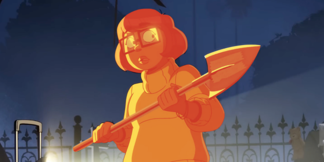 Velma season two: Velma in orange monochrome holding a shovel against a dark blue background