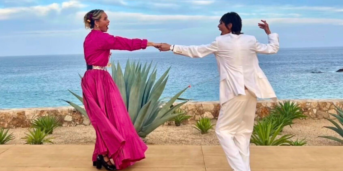 maria and her wife dancing on the beach