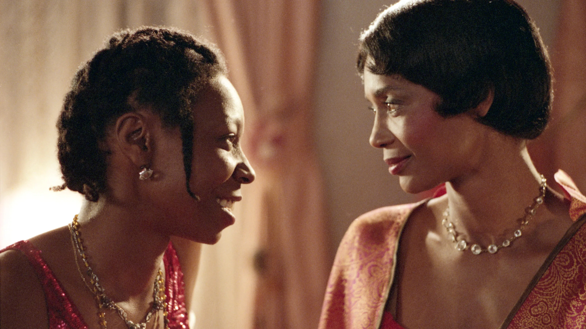 Celie smiles as she makes eye contact with Shug