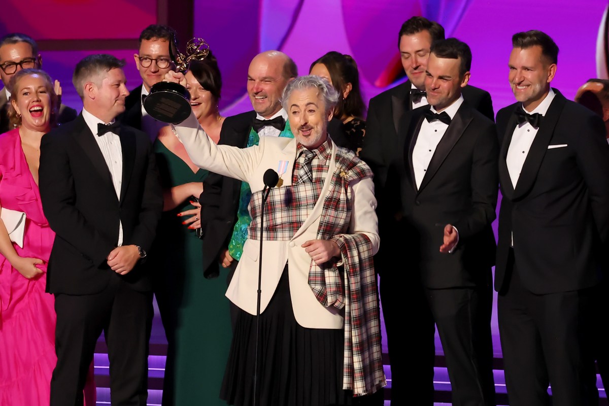LOS ANGELES, CALIFORNIA - SEPTEMBER 15: Alan Cumming (C) and cast and crew accept the Outstanding Reality Competition Program award for “The Traitors” onstage during the 76th Primetime Emmy Awards at Peacock Theater on September 15, 2024 in Los Angeles, California. (Photo by Leon Bennett/WireImage)