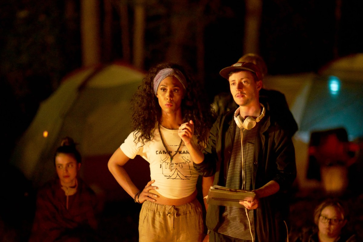 Rhys directs a scene in Adam standing next to Mj Rodriguez