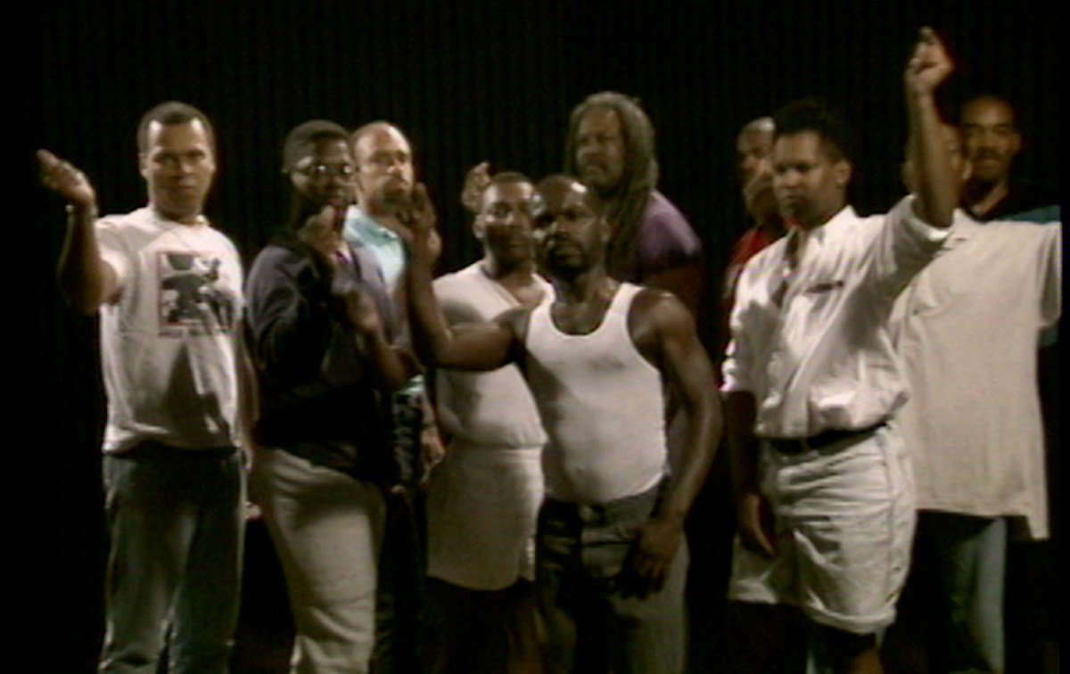 A group of Black men snap.