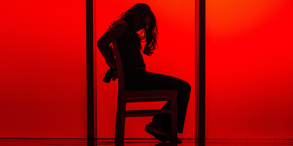 a woman tied in a chair