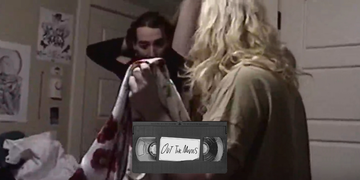 A lo-fi video image of a blonde trans woman holding up two dresses as a brunette trans woman looks on. A VHS tape with Out the Movies is placed over it.