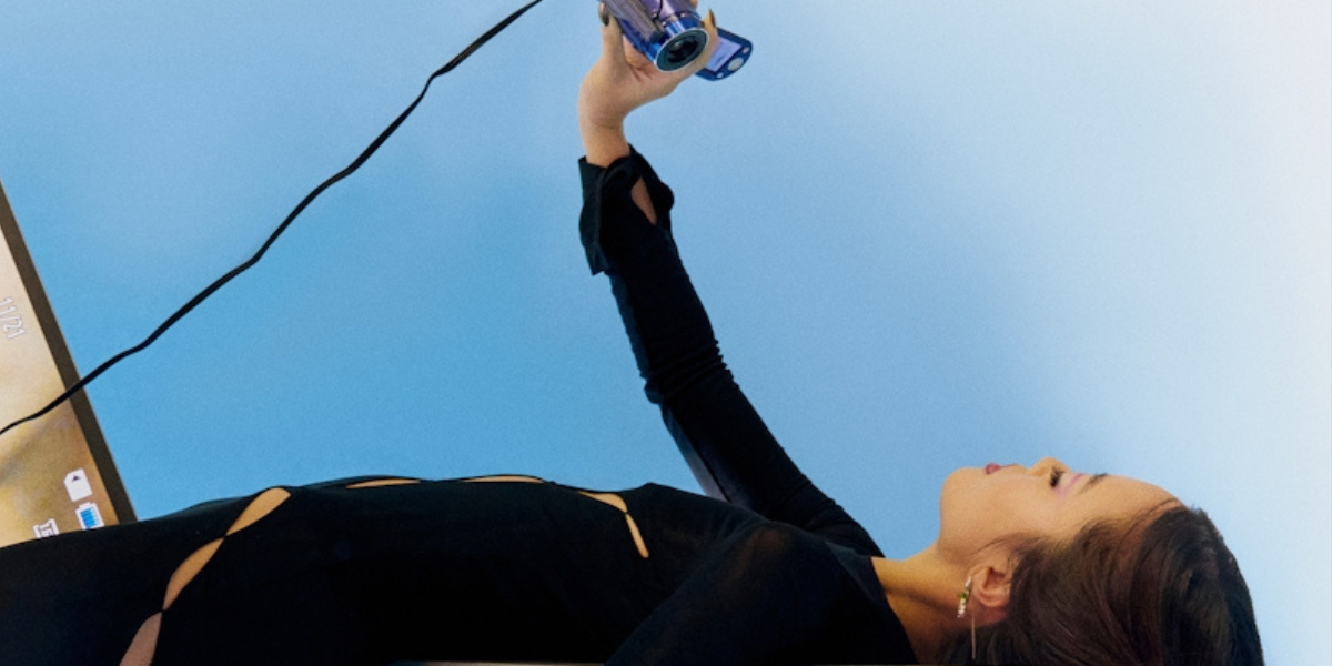 a woman recording herself with a webcam