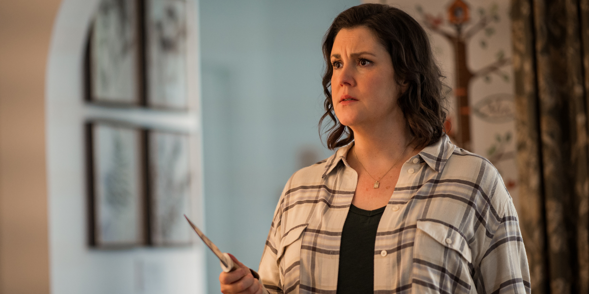 Shauna holding a knife