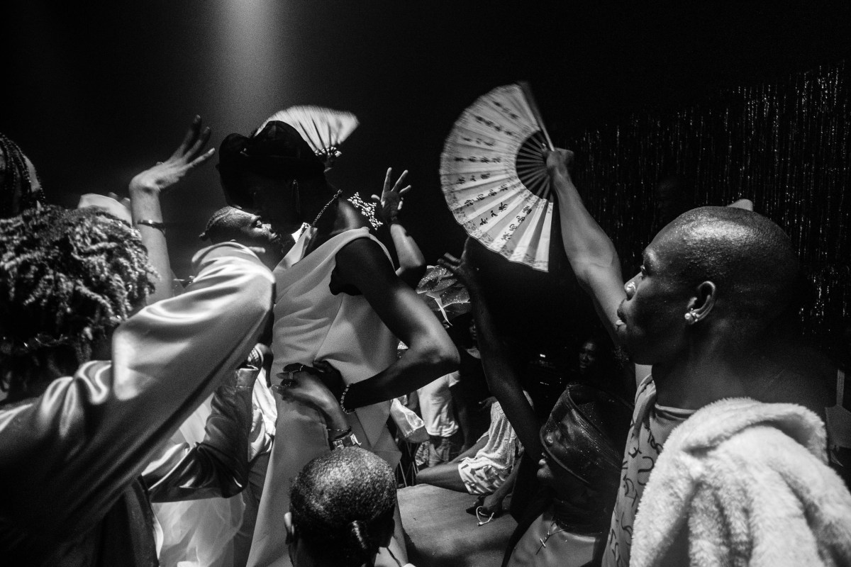 performers and spectators with a fan at the ballroom