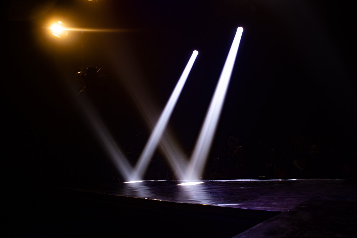 the ballroom stage and lights without bodies on it yet