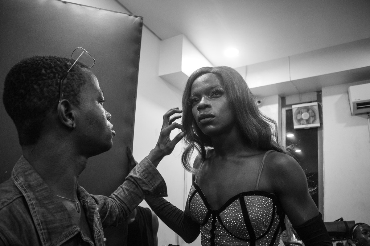a ballroom performer getting touched up backstage