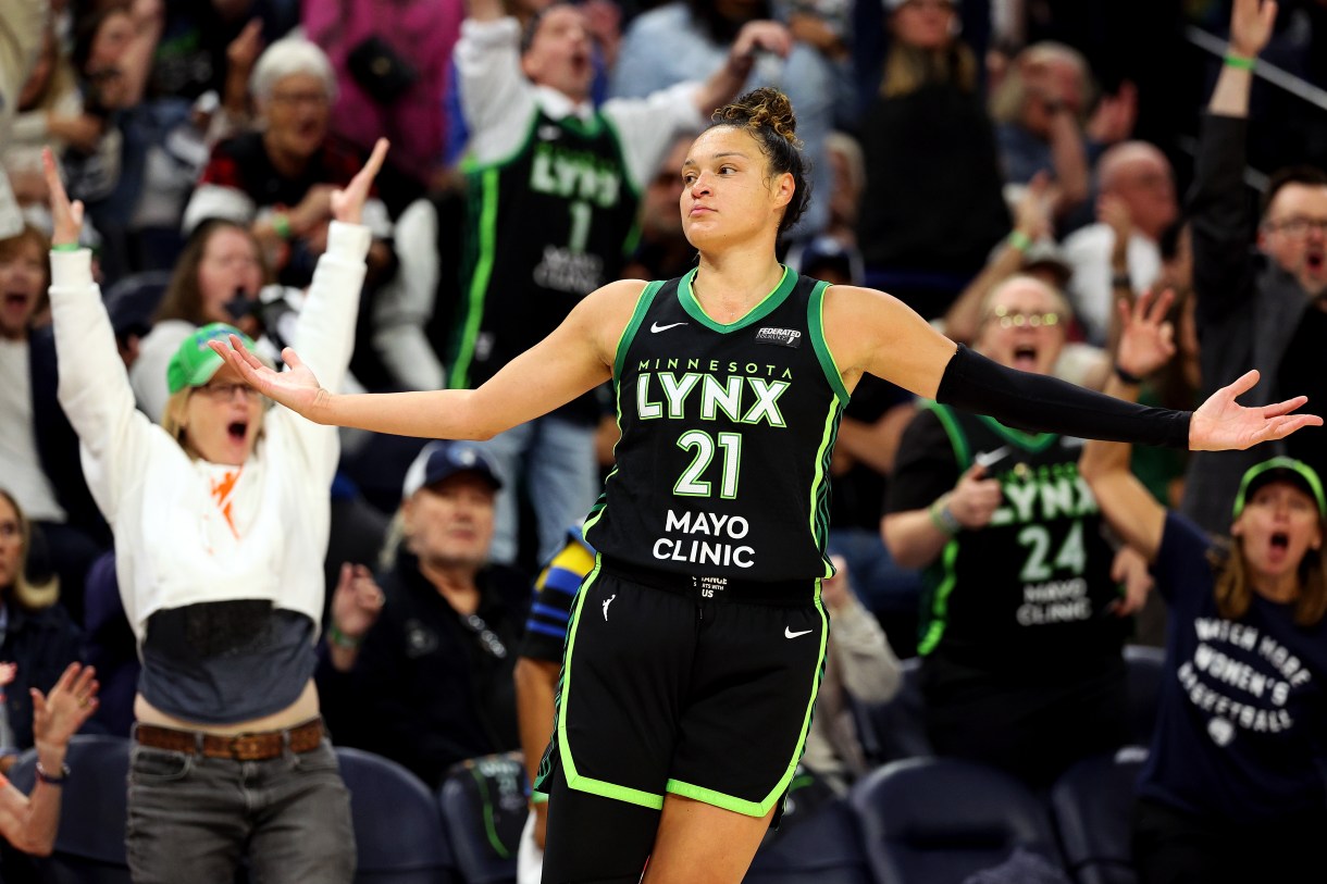 MINNEAPOLIS, MINNESOTA - OCTOBER 08: Kayla McBride #21 of the Minnesota Lynx celebrates her basket against the Connecticut Sun in the first quarter of Game Five of the Semi-Finals during the WNBA Playoffs at Target Center on October 08, 2024 in Minneapolis, Minnesota. 