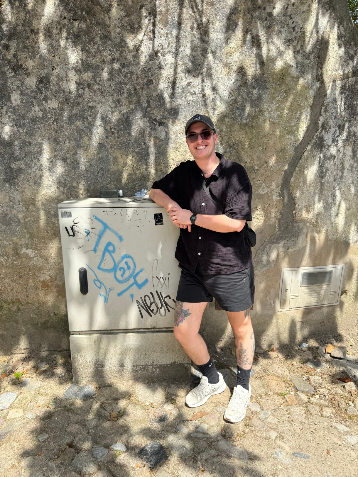 Motti next to a box that says TBOY